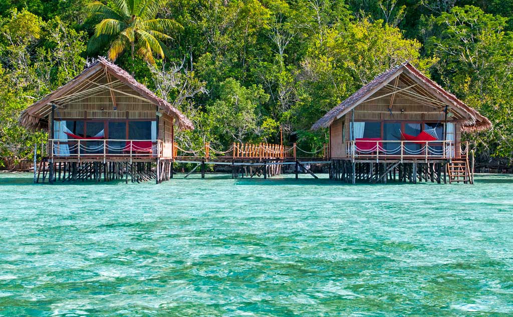 (English) two of our Raja Ampat Overwater Bungalows shown from the ocean side