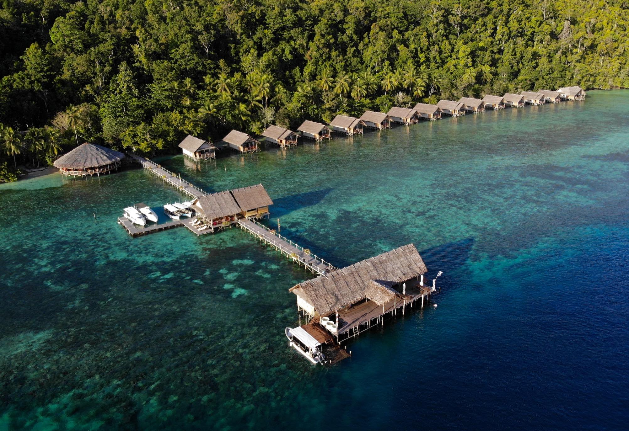 showing the main jetty and the water bungalows of Papua Explorers Eco Resort in Raja Ampat