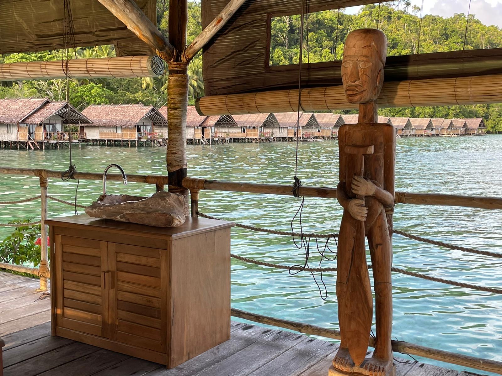 a lady getting a massage treatment at our Papua Explorers spa in Raja Ampat above the water