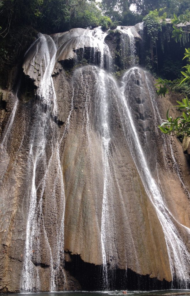 full view of a beautiful waterfall on Batanta island in Raja Ampat which we visit on one of our Papua Explorers daytrips