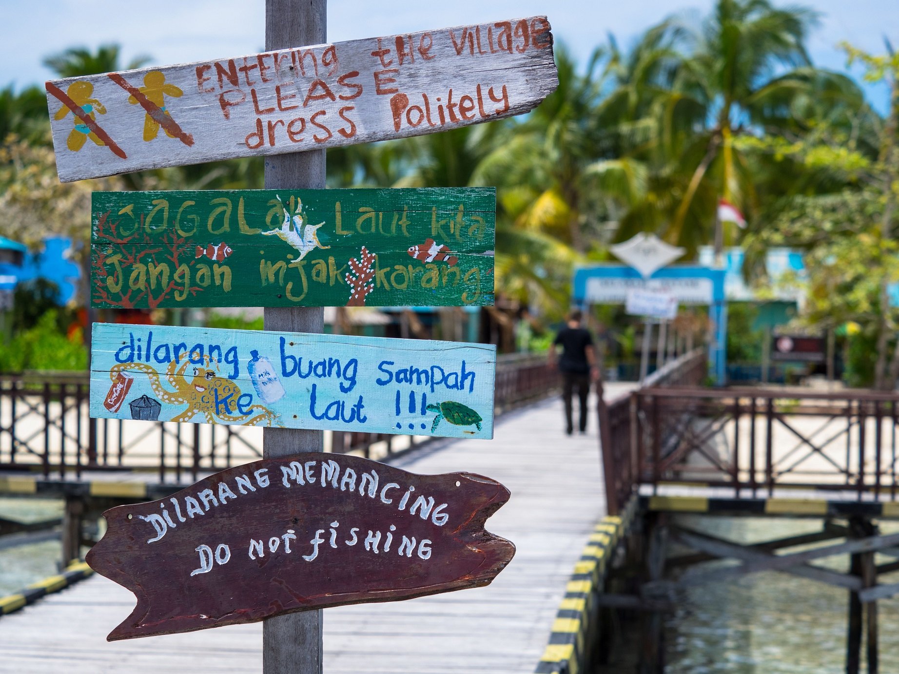 signs on the jetty of Arborek not far from Papua Explorers Dive Resort reminding to treat the environment with care