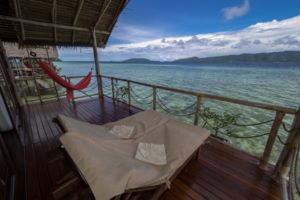 veranda with ocean view that each of our raja ampat overwater bungalows has