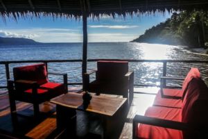 comfortable seating area in our restaurant built over water in Raja Ampat