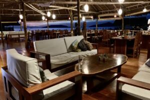 (English) Papua Explorers restaurant at sunset with a comfortable seating corner