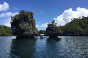 our Papua Explorers boat between mushroom islands on the way back from the Passage in Raja Ampat