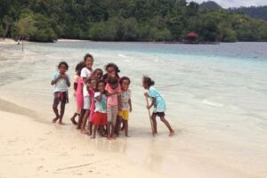 village kids at the beach on Batanta island in Raja Ampat