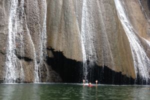 lower part of the Batanta Waterfall with a natural basin to swim in