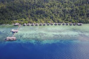 An aerial drone shot of our resort in raja Ampat