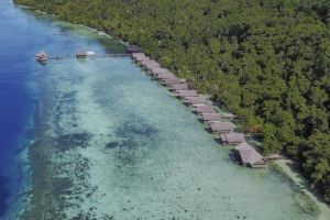 An aerial drone shot of our resort in raja Ampat