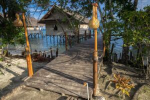 view from the path behind our Raja Ampat Dive Resort towards our water cottages and jetties