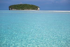 an island reminding of the shape of a loaf of bread close to Papua Explorers Dive Resort