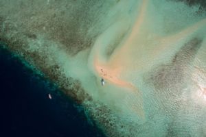 Aerial of a sandbank often used for diving breaks near Papua Explorers Resort