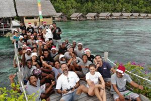 group photo of our employees and managers at our dive resort in Raja Ampat